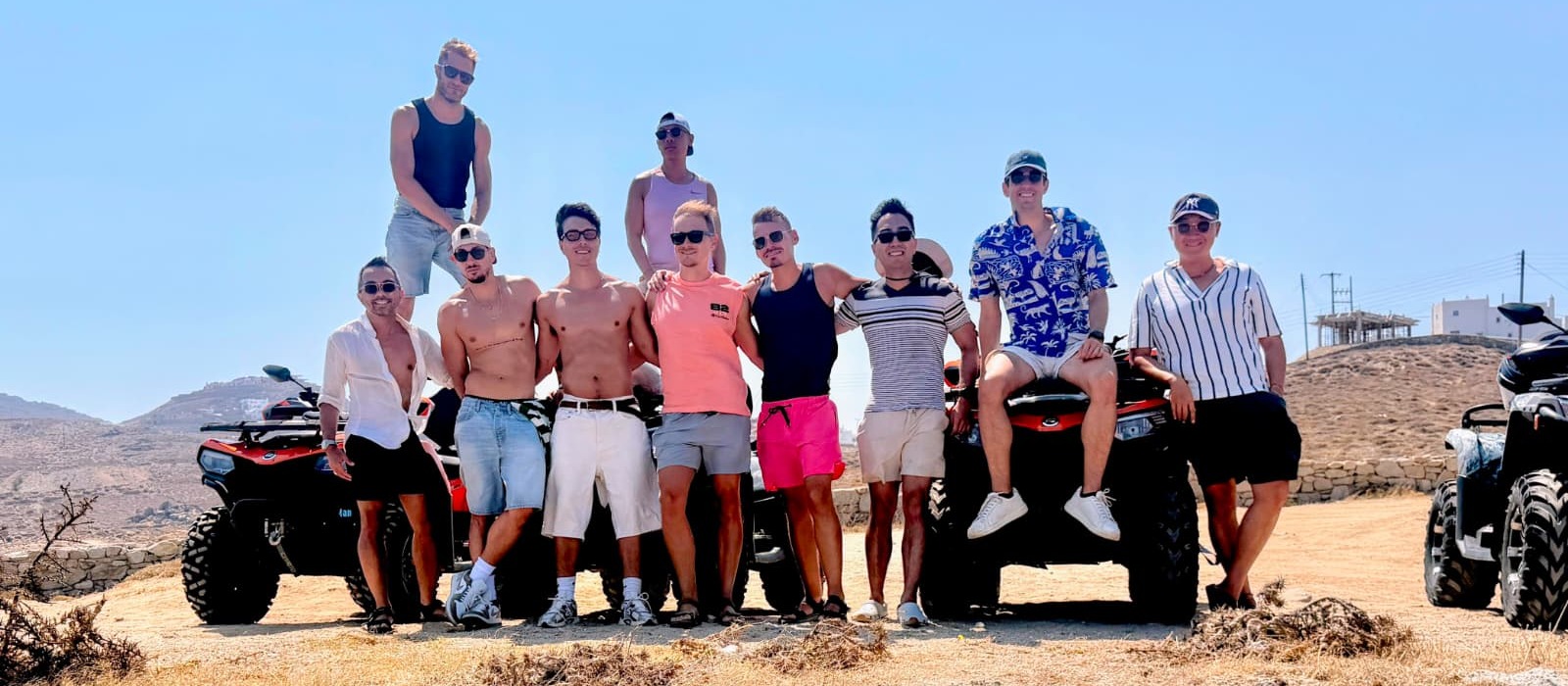 The whole group lined up with the quad bikes on an island road