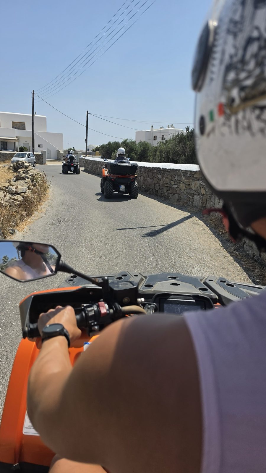 Riding out along an island road behind the rest of the group