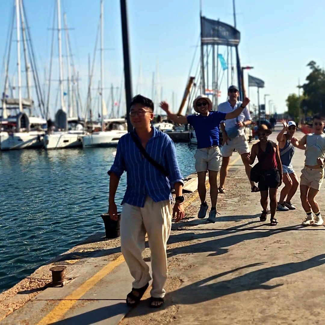 The group heading down the dock to the boat together, bags in hand