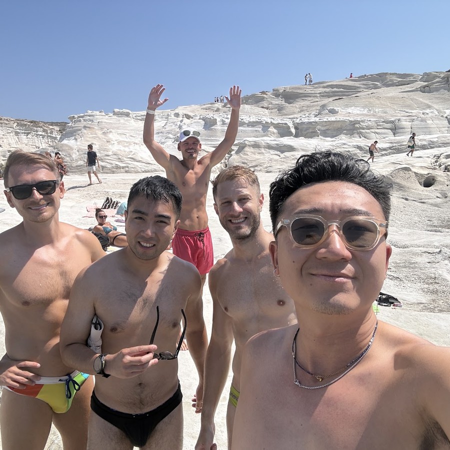 The group together on the white rock at Sarakiniko, Milos
