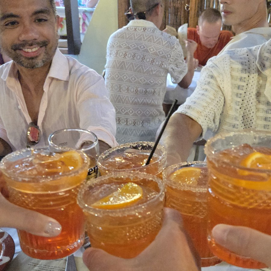 A round of drinks going round the table