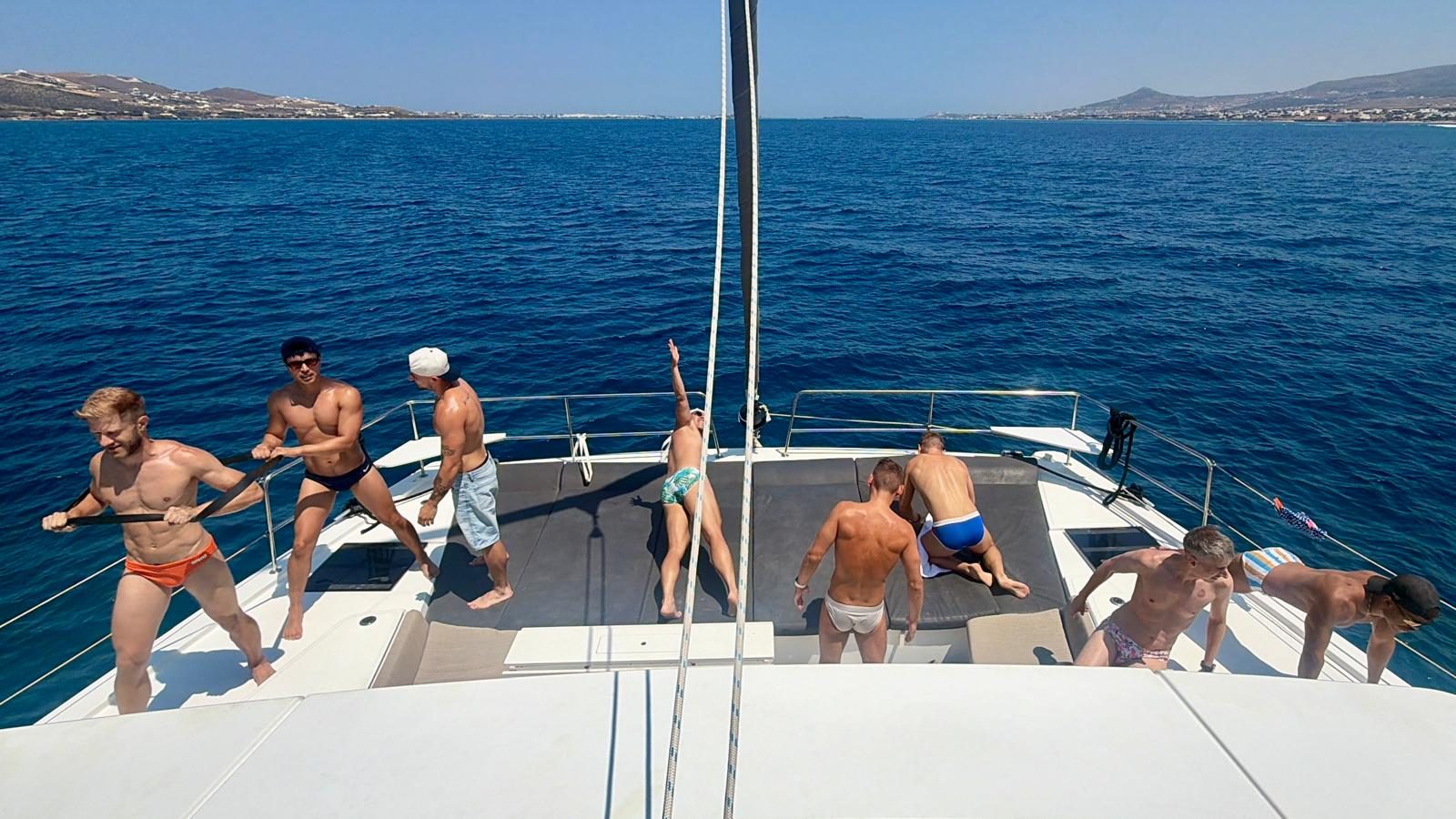 The group on the foredeck of the catamaran