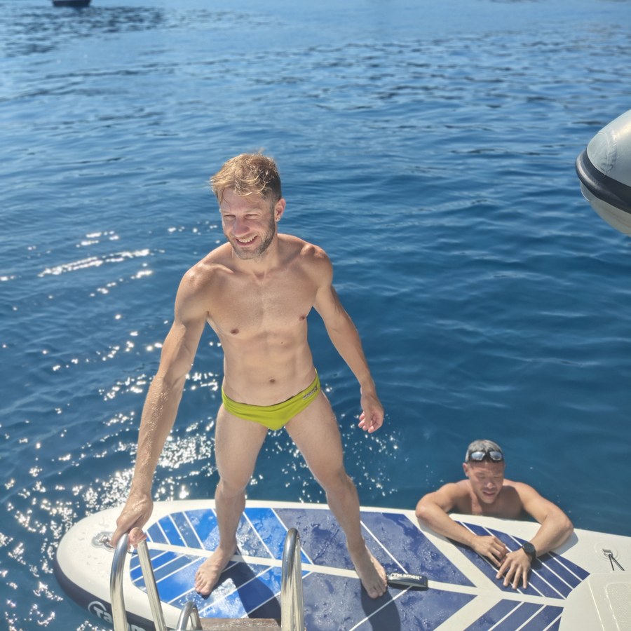 Climbing back aboard after a swim
